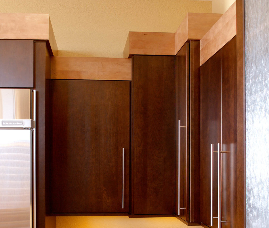 Cherry cabinets with simple maple crownmolding and sleek bar pulls.Cherry cabinets with simple maple crownmolding and sleek bar pulls.