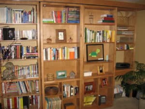 Maple bookcases hide murphy bed