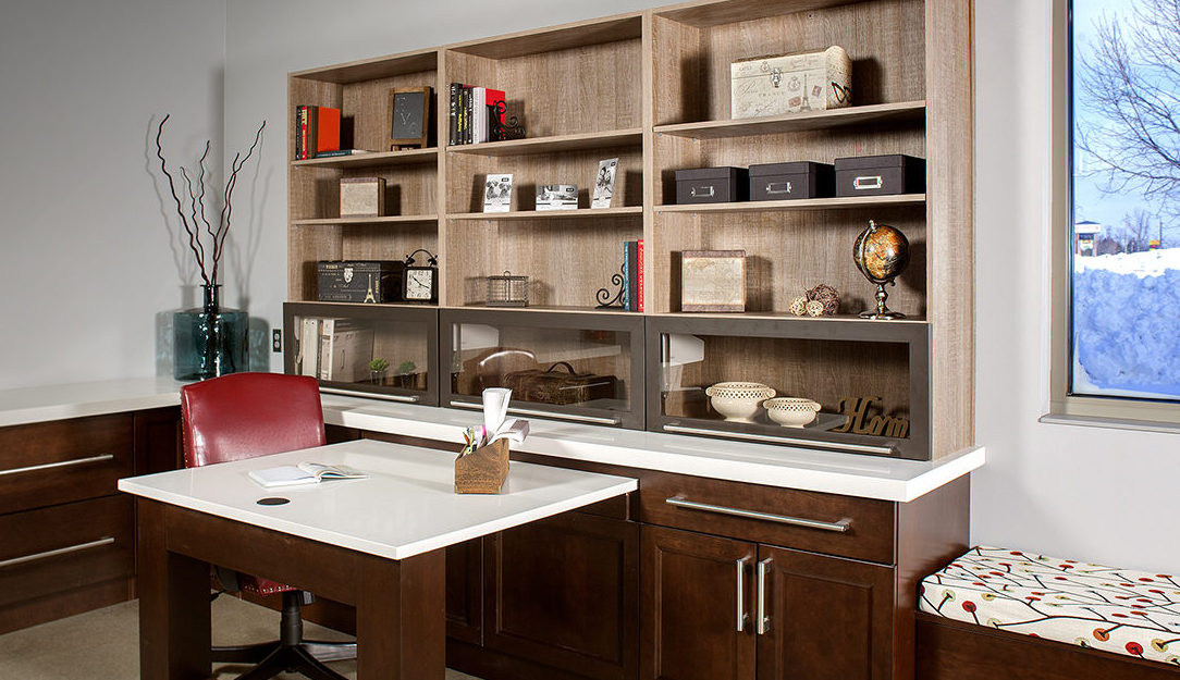 contemporary home office with desk, book cases and credenza