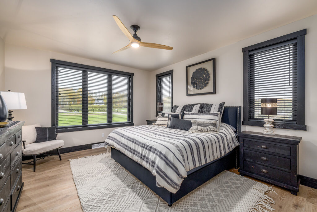 Black and white stripped bedding in master bedroom
