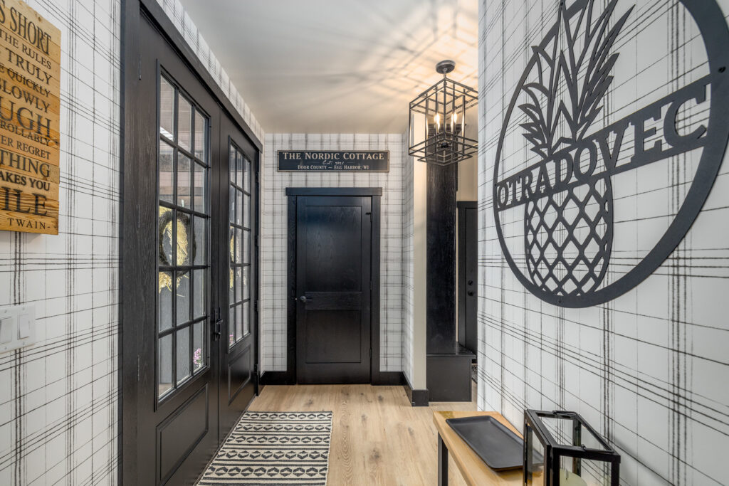 White and black wallpaper in the hallway entry